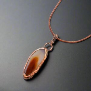 Product Image: Red Agate Slice Pendant Necklace | Copper & Leather