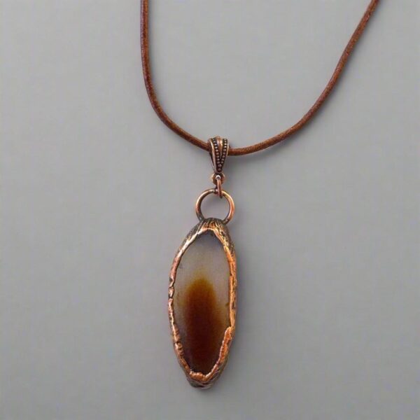 Product Image: Red Agate Slice Pendant Necklace in Copper & Leather