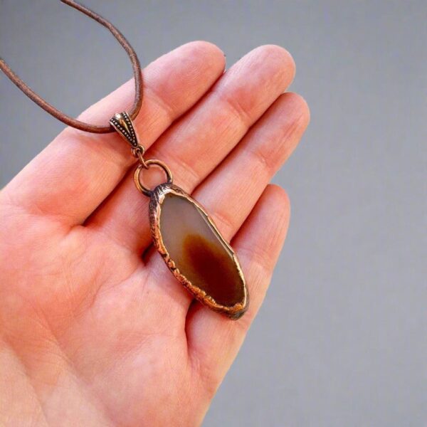 Product Image: Red Agate Slice Pendant Necklace in Copper & Leather
