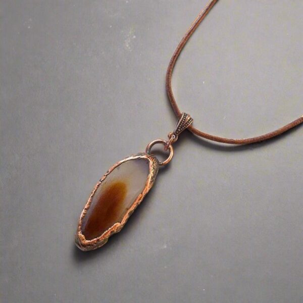 Product Image: Red Agate Slice Pendant Necklace in Copper & Leather