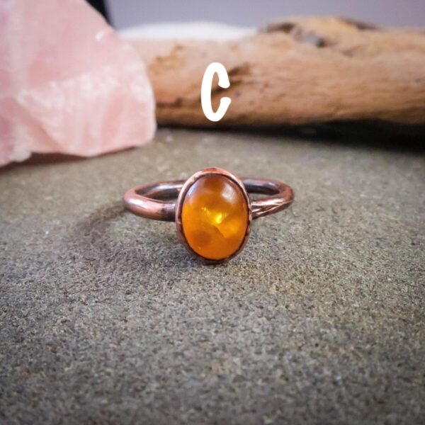 Product Image: Genuine Oval Amber Manifestation Ring in Copper for Positivity