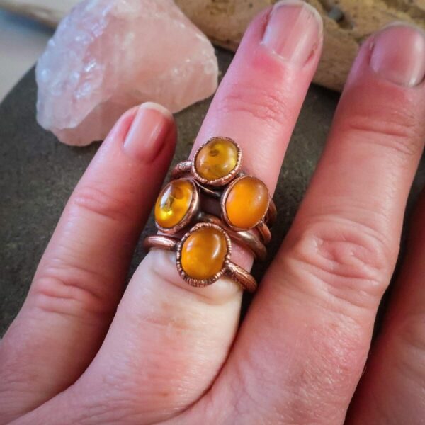 Product Image: Genuine Oval Amber Manifestation Ring in Copper for Positivity