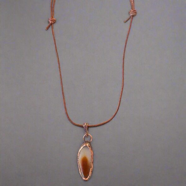 Product Image: Red Agate Slice Pendant Necklace in Copper & Leather