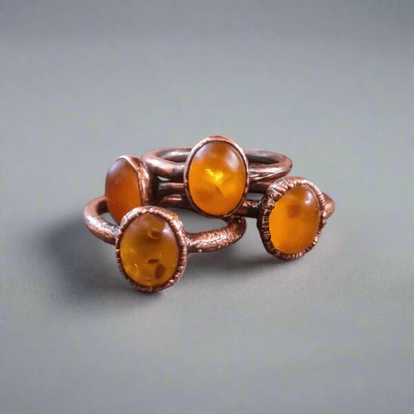 Product Image: Genuine Oval Amber Manifestation Ring in Copper for Positivity