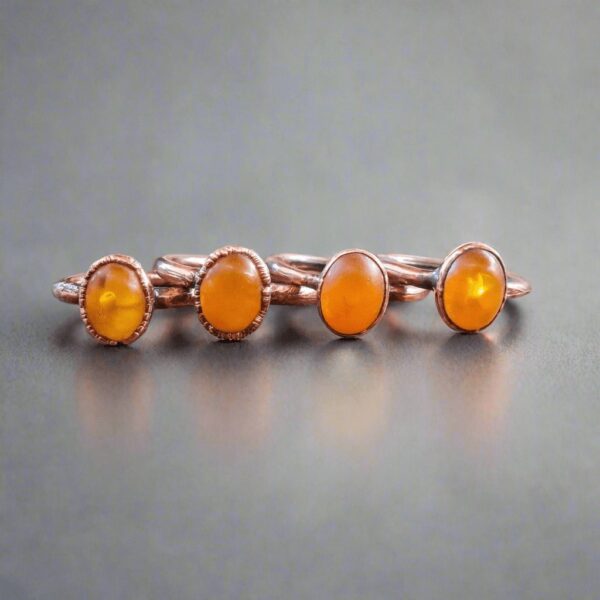 Product Image: Genuine Oval Amber Manifestation Ring in Copper for Positivity