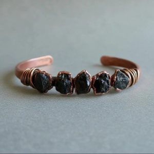 Product Image: Raw Black Tourmaline Copper Cuff – Handcrafted Copper Talisman for Protection