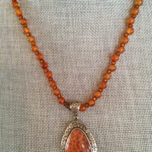 Product Image: Hand-Crafted Fossilized Coral/silver pendant on Carnelian Strand