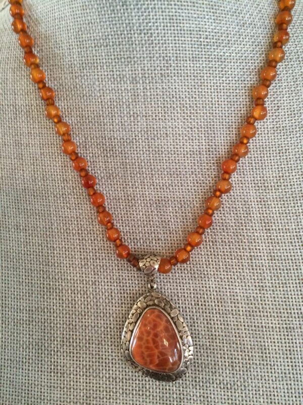 Product Image: Hand-Crafted Fossilized Coral/silver pendant on Carnelian Strand