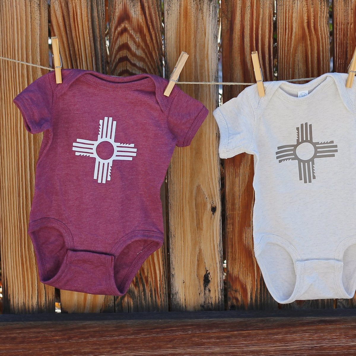 Santa Fe Marketplace Zia New Mexico Baby Onesie Product Image: Zia New Mexico Baby Onesie
