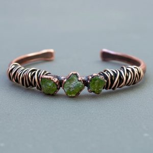 Product Image: Raw Peridot Copper Cuff – Handcrafted Talisman Jewelry for Heart Healing