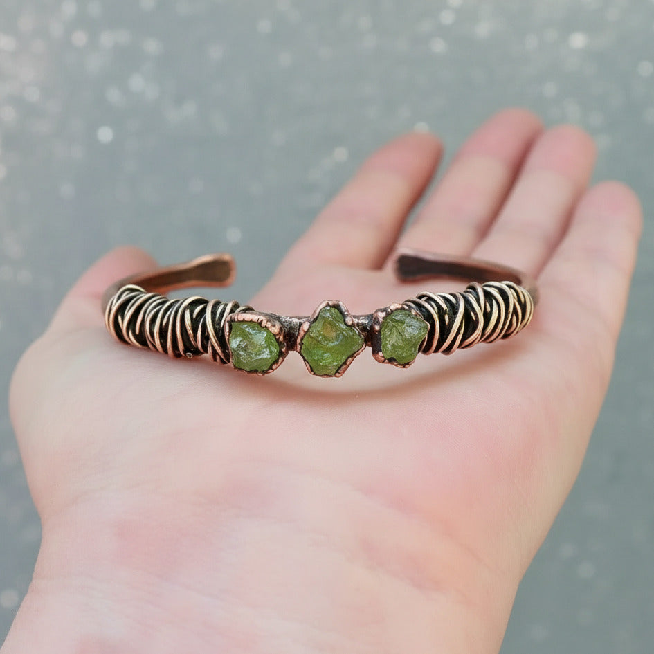 Santa Fe Marketplace Raw Peridot Copper Cuff – Handcrafted Talisman Jewelry for Heart Healing Product Image: Raw Peridot Copper Cuff – Handcrafted Talisman Jewelry for Heart Healing